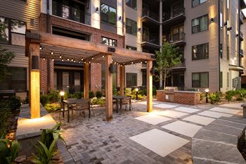 Resort style pool with sun deck & grill picnic area